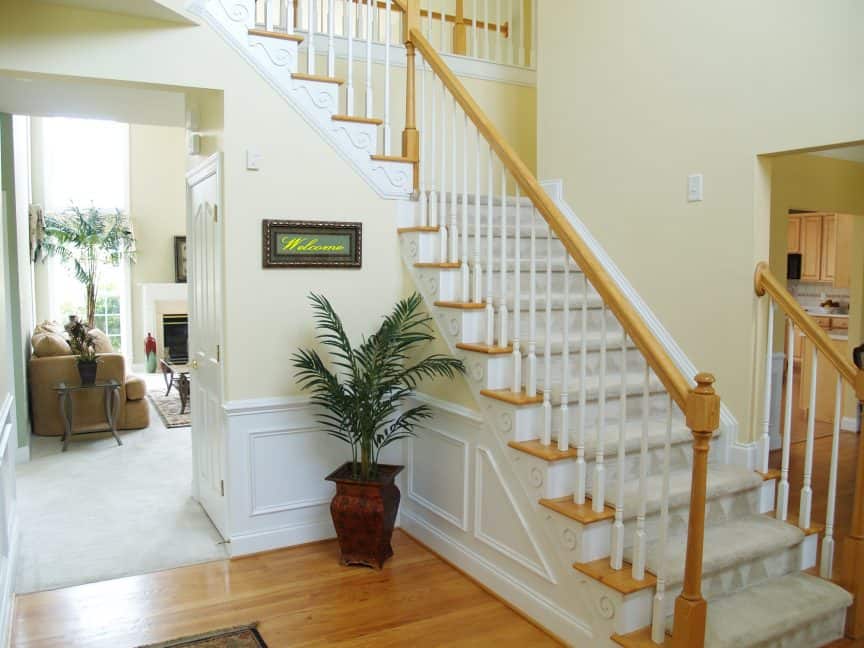 Stairs With Carpet Over Wood Flooring